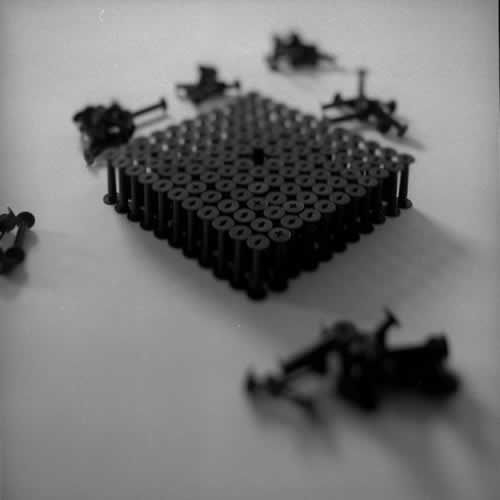 <body>
<p>This work was initially conceived of as a nod to the Terracotta Army of the Qin Emperor. Seeing that the film size ‘120’ for which these spools were manufactured is numerically 11²-1, I arranged this as a phalanx of 11 ranks of 11 and left the centre element out.</p>
<p>I thought I could also look at this omission as a flaw in the lattice and to see how the structure behaved over time, perhaps to model the corruption of power while I worked on the Dissent project with Chapel Arts. </p>
</body>
 Images Copyright Aldobranti® ©2008-'2025. All rights reserved.